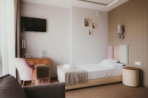 Hotel Wróblewscyにあるベッド