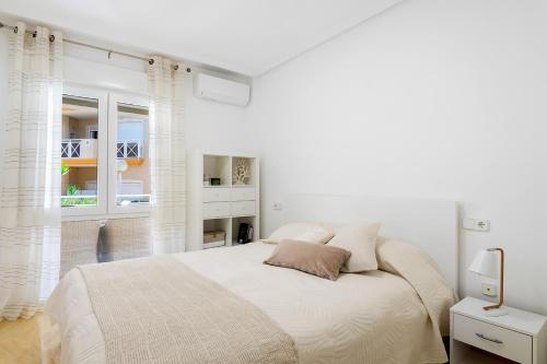 Postel nebo postele na pokoji v ubytování CB Living - Beachfront apartment in Aguamarina