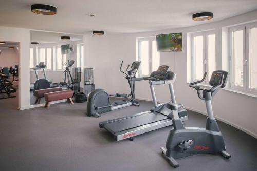 a gym with several exercise bikes in a room at Vienna House Easy by Wyndham Leipzig in Leipzig