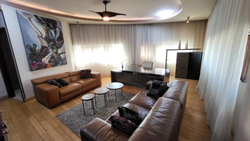 a living room with a couch and a table at Design Hotel Mr President in Belgrade