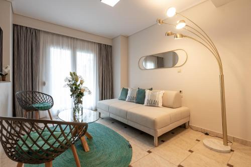 a living room with a couch and a table at Poseidonio in Piraeus