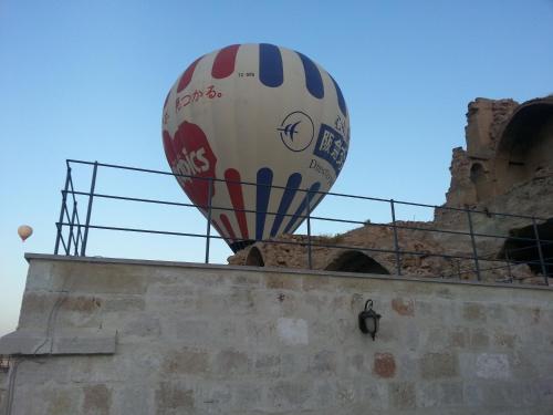 a hot air balloon sitting on top of a wall at Fairyland Cave Hotel in Goreme
