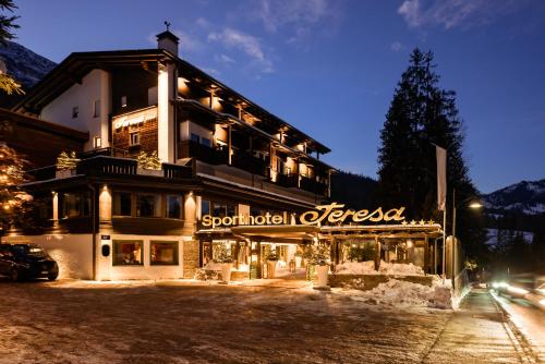 a large building with a sign that reads spood hotel at Sporthotel Teresa in Badia