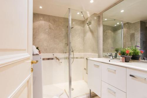 a bathroom with a shower and a sink at View on the Bay AP4294 By Riviera Holiday Homes in Villefranche-sur-Mer