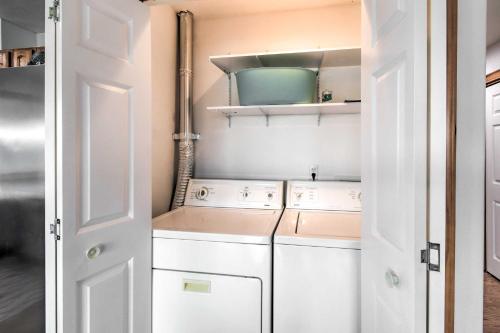 a laundry room with a washer and dryer at Canal-Front Vacation Rental in Ocean Shores in Ocean Shores