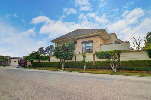 a house on the side of a street at Stayvista at Ekant - Exquisite 3BHK with Private Pool in Amritsar in Amritsar