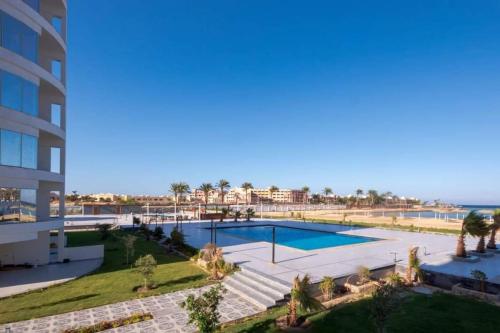 an image of a swimming pool at a resort at You are welcome to Mido Shallet in Naqādah