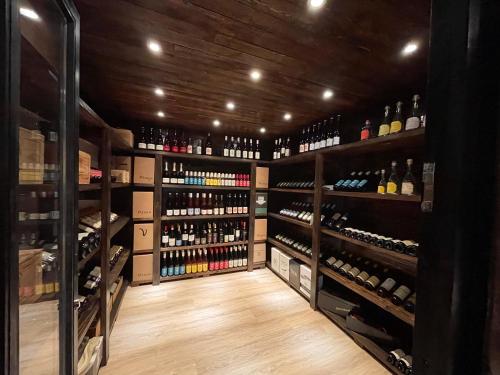 a wine cellar with lots of bottles of wine at Rosenhof-Lodge in Hanerau-Hademarschen