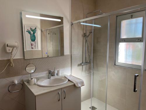 a bathroom with a sink and a shower at PUERTO BANUS POL One in Marbella
