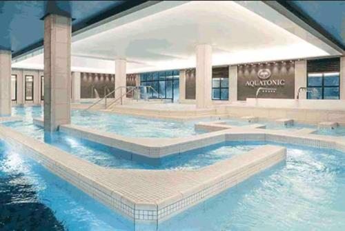 a rendering of a swimming pool in a hotel at Appart COSY F2 Disneyland/Val d'Europe in Montévrain