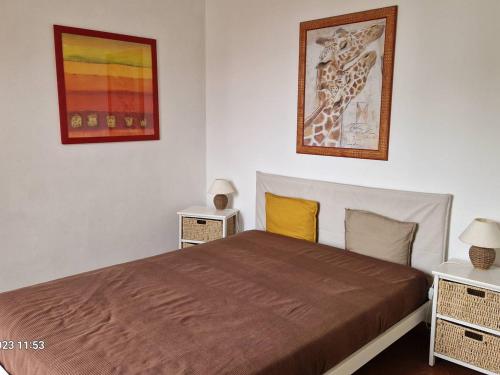 a bedroom with a large bed with two night stands at Villa Le Lavandou, 3 pièces, 6 personnes - FR-1-610-44 in Le Lavandou