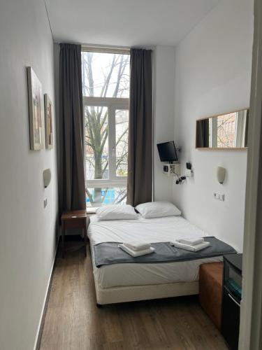 Postel nebo postele na pokoji v ubytování MAX Hotel Amsterdam