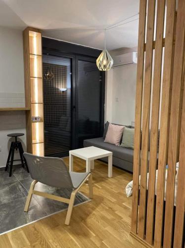 a living room with a couch and a chair at Apartment A20 in Novi Sad