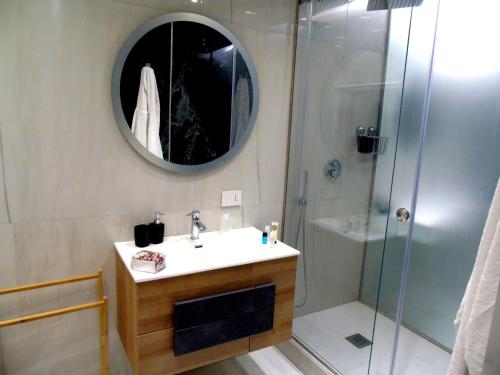 Ένα μπάνιο στο Massimo Luxury Rooms