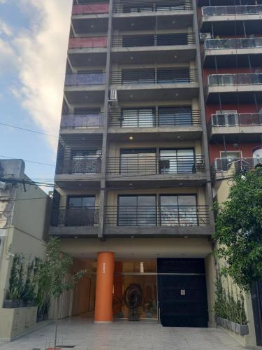 a tall apartment building with balconies on it at Jade Barrio Sur A Estrenar by Citrino Aparts in San Miguel de Tucumán