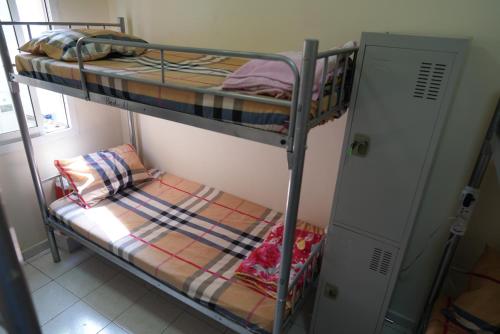 a couple of bunk beds in a room at Decent Holiday Homes & Hostels near Burjuman Metro Station in Dubai