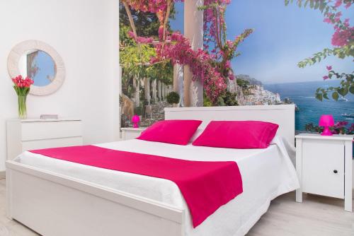 Postel nebo postele na pokoji v ubytování Stanza Tasso - De Vivo Realty Sorrento