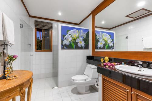 a bathroom with a toilet and a sink at 3 BR Pool Villa - Kids Paradise in a beachside resort in Choeng Mon Beach