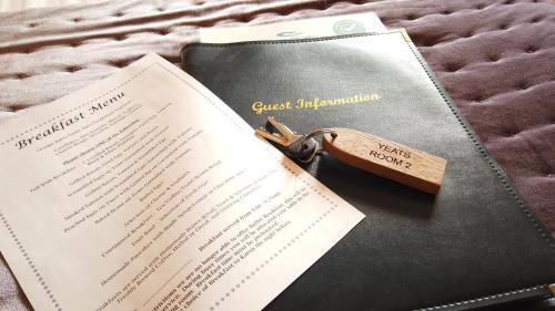 a pair of keys sitting on top of a book at Ocean Heights B&B in Lissadell