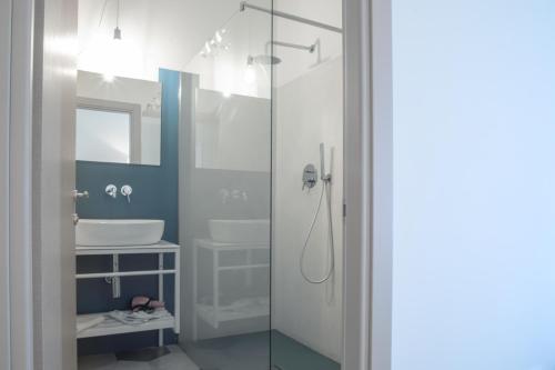 a bathroom with a shower and a sink at Hotel Villa Ambra in Orbetello