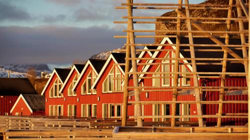 a building under construction with scaffolding around it at Lofoten Basecamp in Leknes