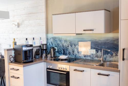 Η κουζίνα ή μικρή κουζίνα στο StrandBerg's Stadt Chalet