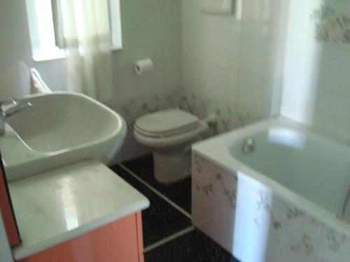 a bathroom with a sink and a toilet and a tub at Splendid apartment near beaches and Boccadasse in Genoa