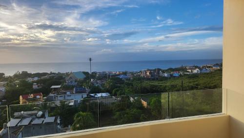 a view of the ocean from a balcony at SEAVIEW LUXURY APPARTMENT in Flic-en-Flac