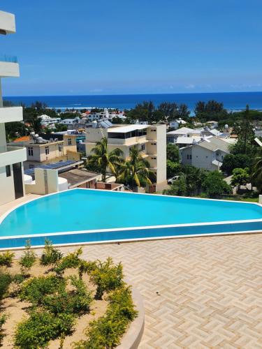 a view of a swimming pool from a building at SEAVIEW LUXURY APPARTMENT in Flic-en-Flac