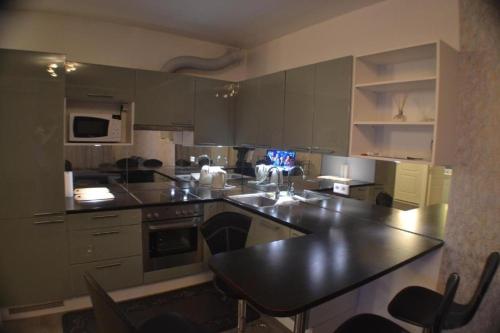 Dapur atau dapur kecil di Riverside Apartment