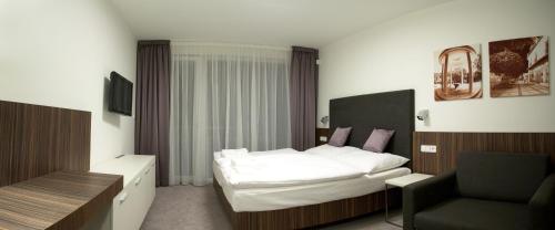 Postel nebo postele na pokoji v ubytování Hotel Pohoda