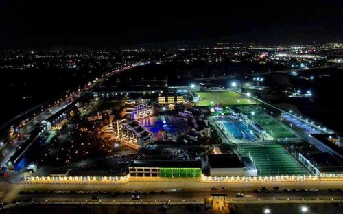 an aerial view of a soccer stadium at night at The Guard Hotel in Cairo