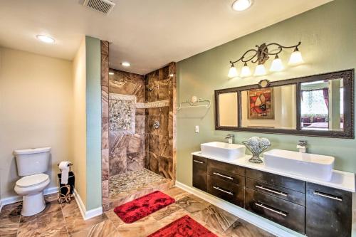 een badkamer met 2 wastafels en een douche bij Major Manor New Orleans Home with Pool and Game Room in New Orleans