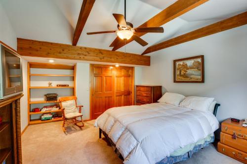 a bedroom with a bed and a ceiling fan at Silver Plume Mountain Haven with Views and Deck! in Silver Plume