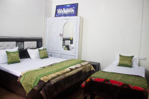 Ένα ή περισσότερα κρεβάτια σε δωμάτιο στο Aranyam Home Stay