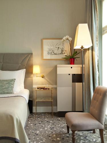 Ένα ή περισσότερα κρεβάτια σε δωμάτιο στο Hôtel Thérèse