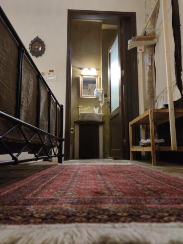 a hallway with a staircase leading to a room at Porolithos Boutique Hotel in Rhodes Town