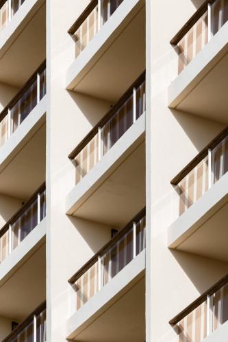 a facade of a white building with windows at Mondrian Cannes in Cannes