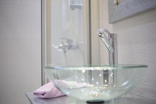 a glass bowl sink sitting on a counter in a bathroom at Villa Nena in Makarska