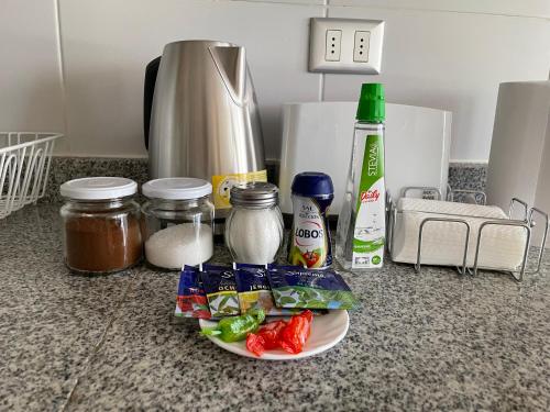 a plate of food on a kitchen counter with ingredients at Departamento Chillan céntrico in Chillán