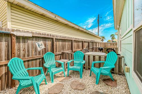 a group of four chairs and a table on a patio at Nemo Cay - Endless Summer I in Padre Island