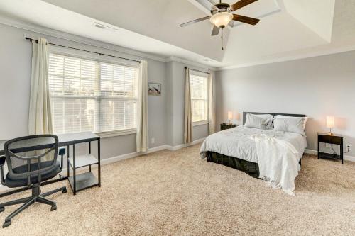 a bedroom with a bed and a desk and a window at Family-Friendly Clarksville Vacation Rental! in Clarksville