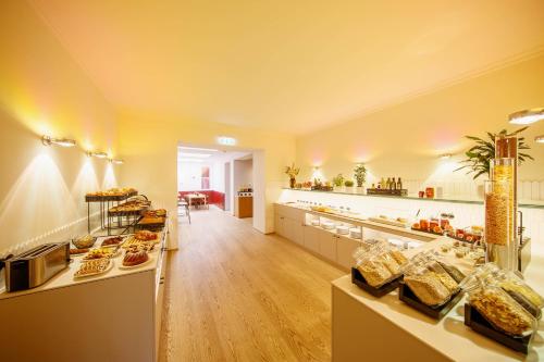 a large kitchen with a lot of food on display at Der Wilhelmshof in Vienna