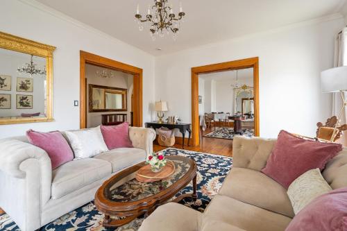 a living room with two couches and a table at Stratton Creek Inn in Stratton