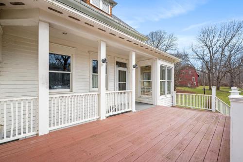 a porch of a house with a wooden deck at Stratton Creek Inn in Stratton