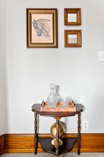 a table with a vase on it in a room at Stratton Creek Inn in Stratton