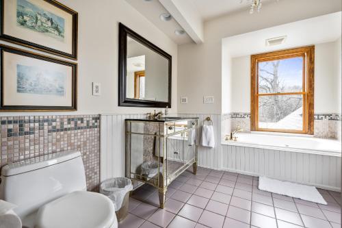 a bathroom with a toilet and a sink at Stratton Creek Inn in Stratton