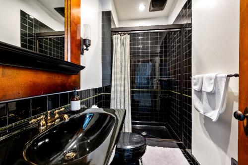 a bathroom with a sink and a shower at Stratton Creek Inn in Stratton