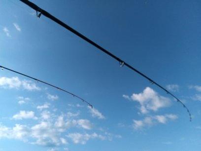 a wire against a blue sky with clouds at Chill & Relax Apartment in Siófok