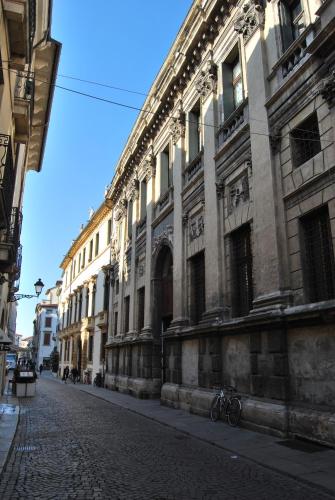 a bike parked on a street in front of a building at Palazzo Valmarana Braga in Vicenza